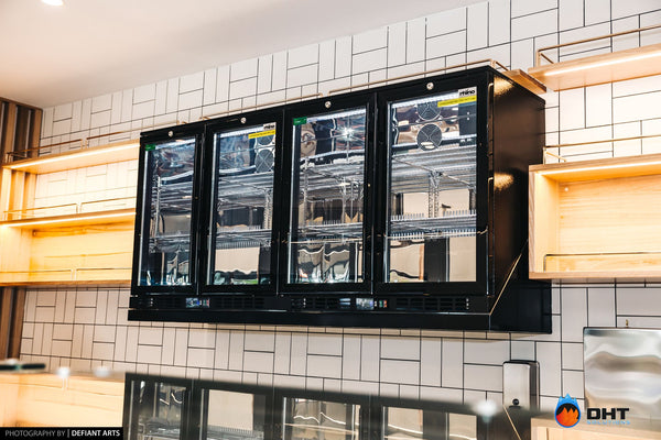 Wall-mounted four-door glass-door fridge above the counter