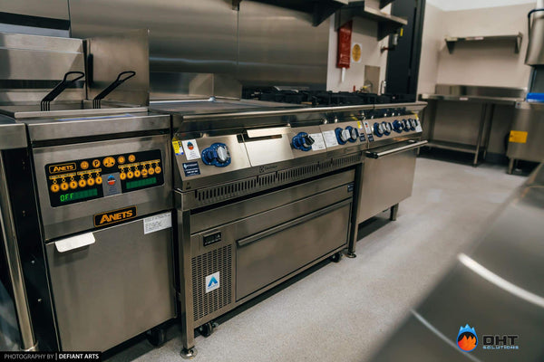 Anets gas fryer beside the Electrolux cooking suite, with an Adande refrigerated drawer built in underneath