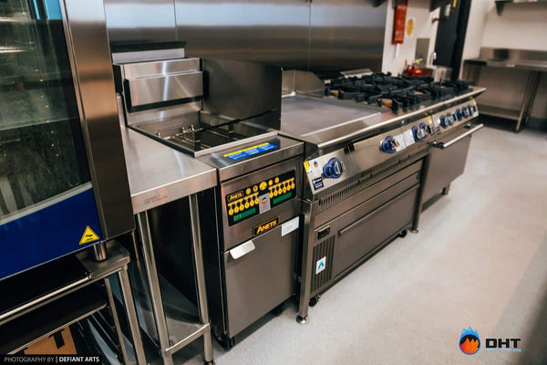 Anets fryer, griddle and gas burner tops running along the cooking line