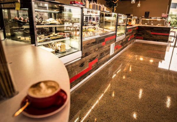 The run of refrigerated display cabinets along the front counter