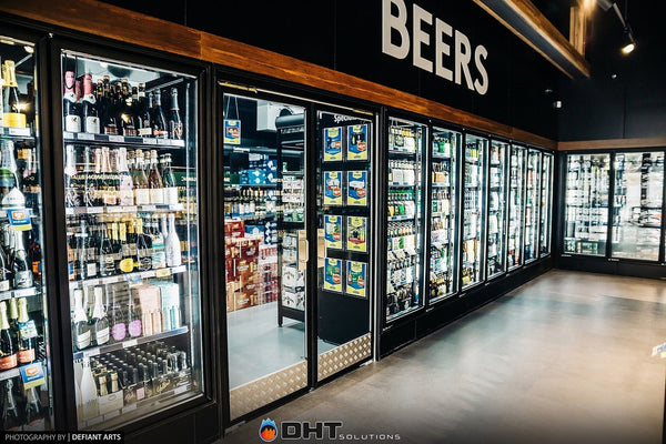 The run of glass cool room doors under the BEERS sign