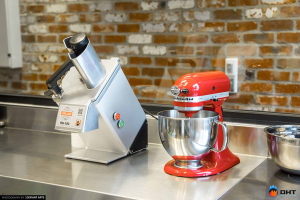 Hallde RG-100 vegetable preparation machine and a KitchenAid mixer on the stainless bench