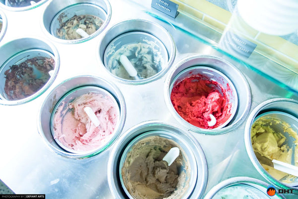 Tubs of gelato in the refrigerated ice cream display
