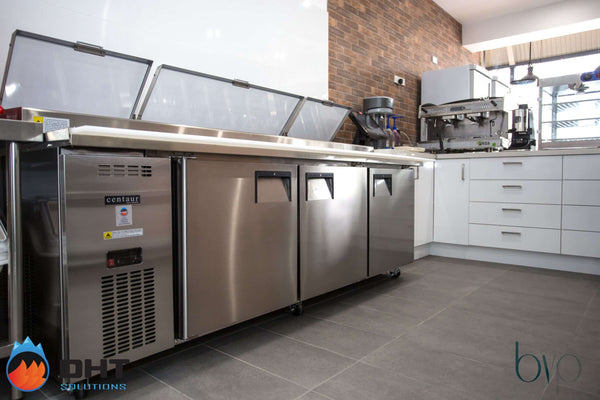 Skope pizza preparation fridge with its lids raised, with the coffee machine on the back counter