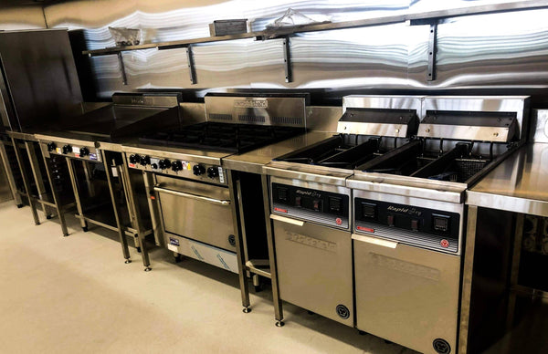 Goldstein cooking line-up with griddle, gas burners and two Rapid Fry fryers