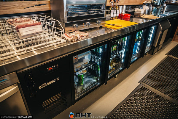 Williams under-counter refrigeration along the servery bench, with a Roband grill above